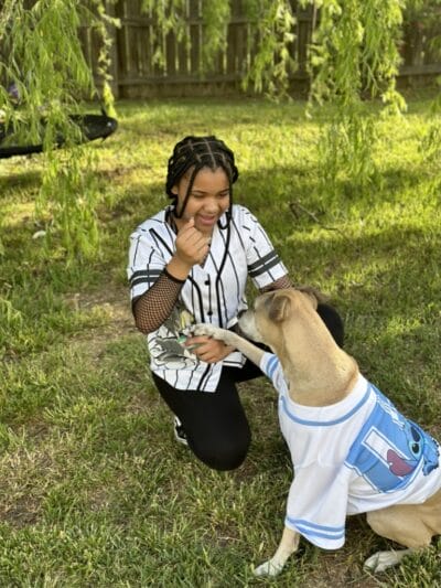 dog with student playing