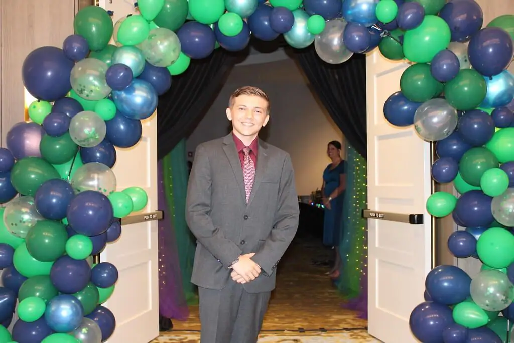 student boy in formal suit at prom