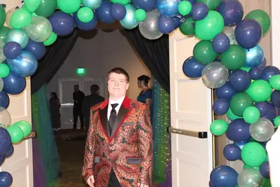 student boy in formal suit at prom