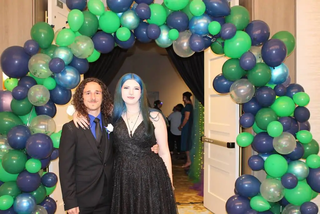 students smiling at the prom