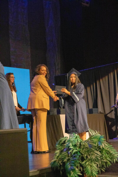 student receiving a diploma