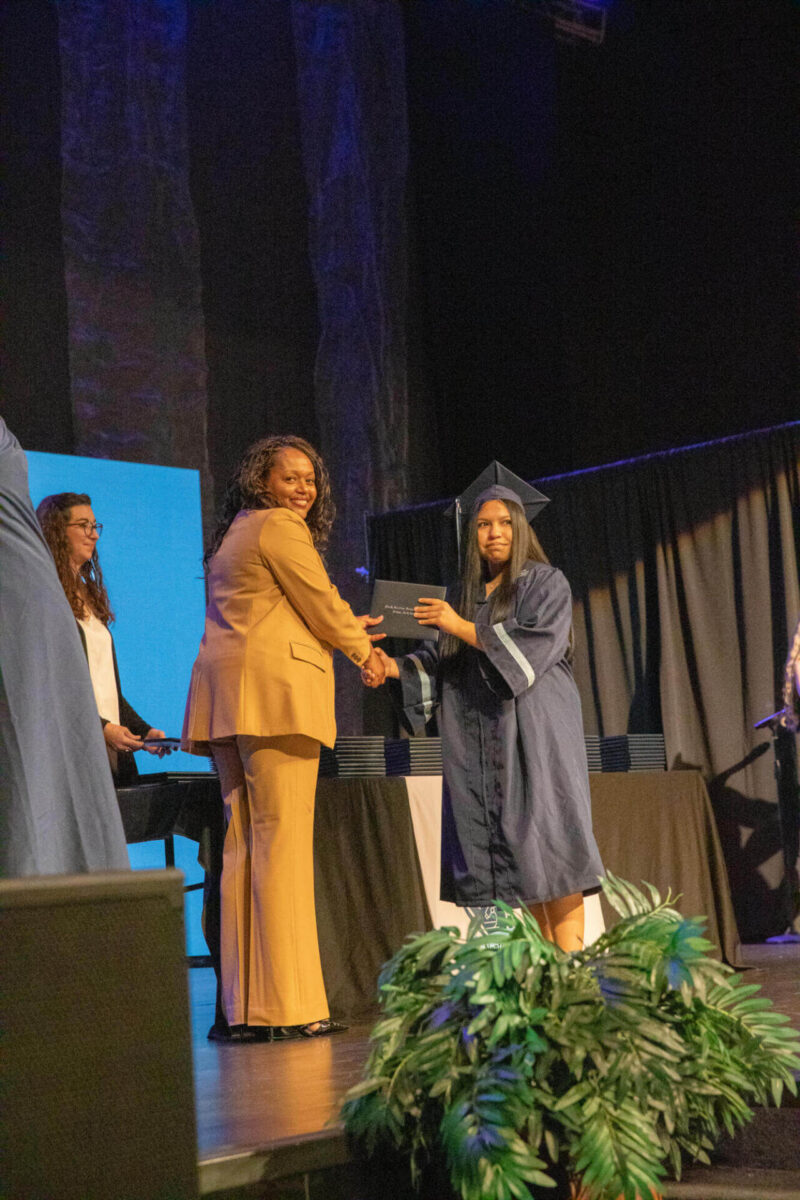 student receiving a diploma