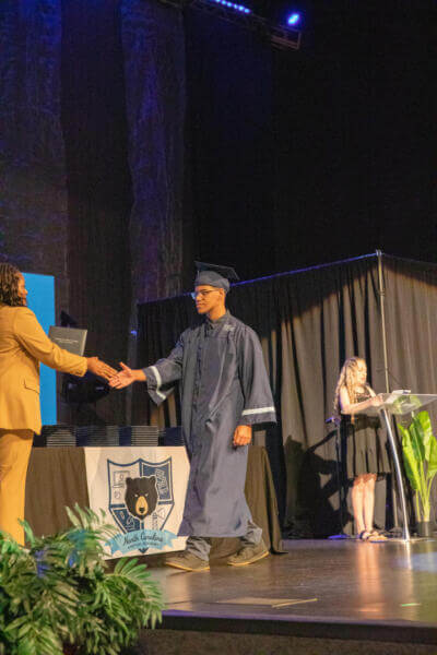 boy receiving a diploma