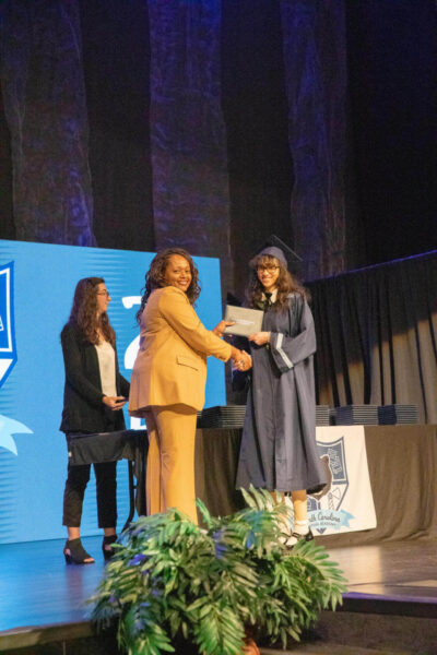 student girl with director and diploma