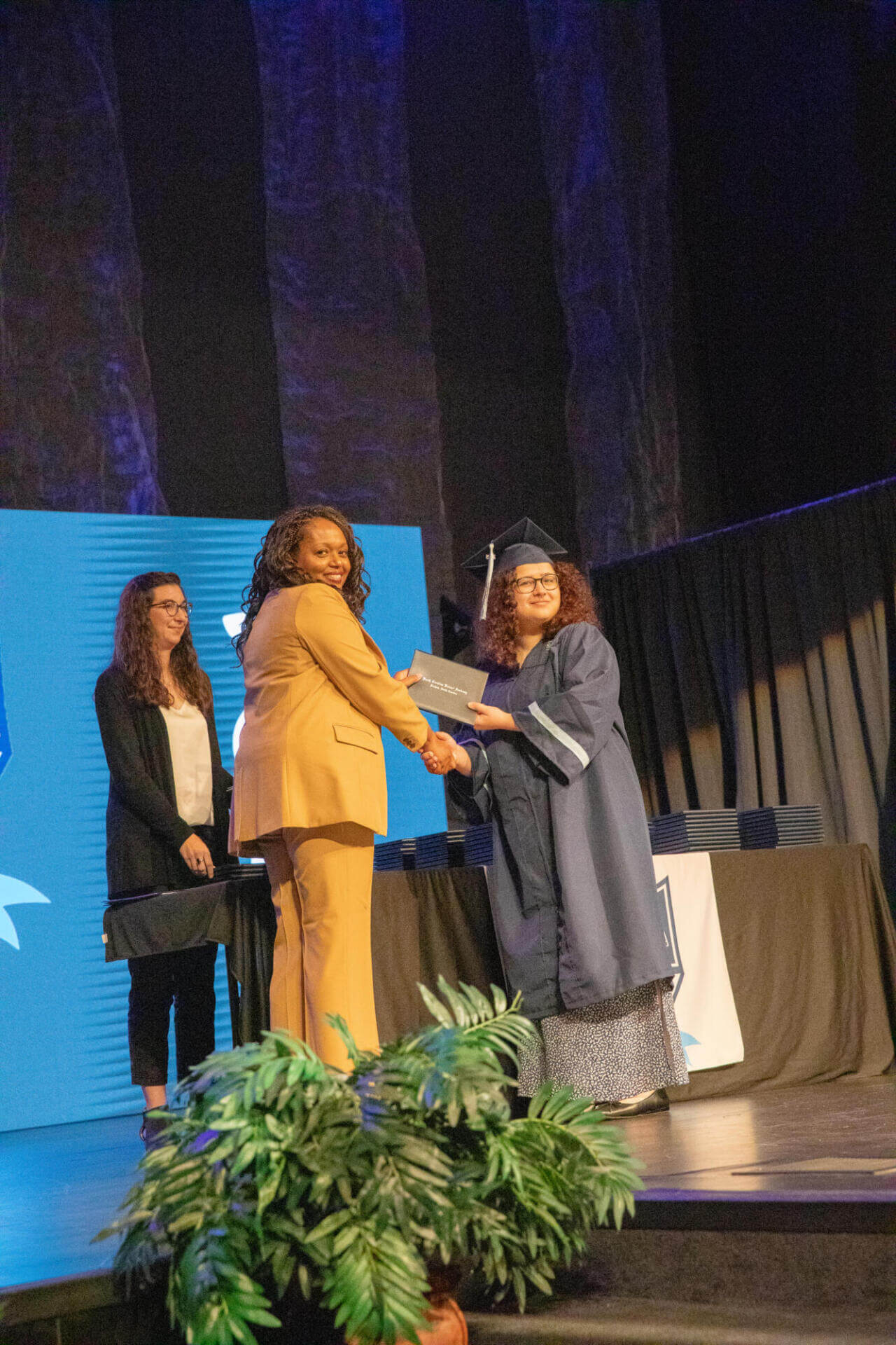 happy girl receiving the diploma