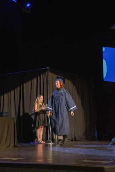 happy student walking for the diploma