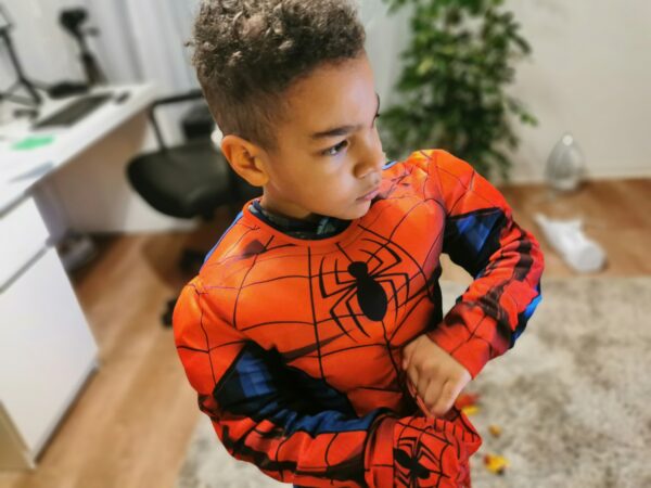 Kid wearing an spiderman costume