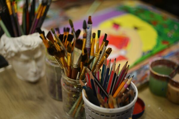 Paintbrushes and art supplies for student creative arts club